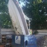 Boat in dumpster