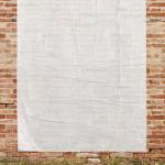 blank poster on brick wall