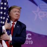 Trump hugging Flag