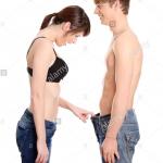 Woman looking in man's pants