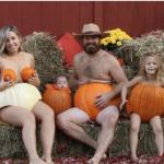 family in pumpkins