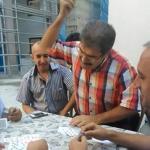 Angry turkish man playing cards