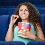 Woman eating popcorn