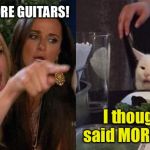 Crying Lady and Confused Cat | I SAID NO MORE GUITARS! I thought you said MORE guitars! | image tagged in crying lady and confused cat | made w/ Imgflip meme maker
