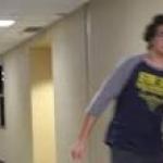 Guy running down hallway