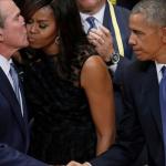 George Bush kissing Michelle Obama