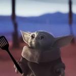 Baby Yoda holding spatula