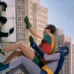 Batman and Robin climbing