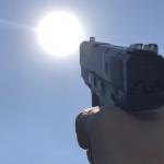 Shooting gun at the sun