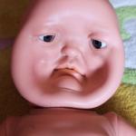 Dented face Baby doll