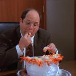 Costanza eating shrimp