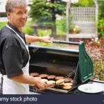 Guy grilling burgers