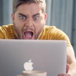 Man Screaming At Laptop