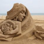 Sleeping Girl with Butterfly and Rose | image tagged in vince vance,sand,sculpture,expert level,flower,butterfly | made w/ Imgflip meme maker