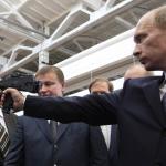 Putin holding gun