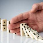 Hand Stopping Dominoes