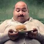 Fat man with burger