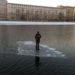 Guy On Ice In The Middle Of Pond