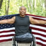 Amputee in Wheelchair American Flag