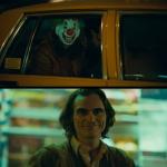 Joker Looks At Clown In Taxi