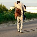 Man carry woman shoulder