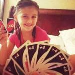 girl with two uno cards