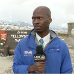 Reporter looking at bison