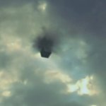 Black cube in sky over Texas