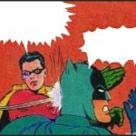 Robin slapping Batman