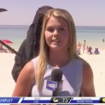Grim reaper on beach with reporter