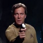 kirk holding phaser at camera