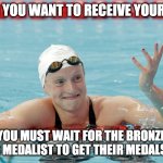 Katie Ledecky | WHEN YOU WANT TO RECEIVE YOUR GOLD; BUT YOU MUST WAIT FOR THE BRONZE AND SILVER MEDALIST TO GET THEIR MEDALS FIRST | image tagged in katie ledecky | made w/ Imgflip meme maker