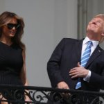 Trump looking at the eclipse