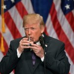 Trump drinks glass of water with both hands