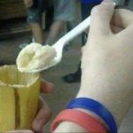Eating banana with a spoon