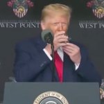 Trump drinking with two hands