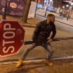 Guy Swinging Stop Sign