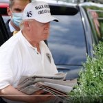 Trump Carries Newspapers to Pretend He Reads