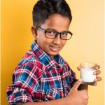 Indian kid with milk glass