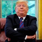 Trump frowning, arms folded