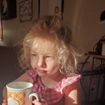 Tired toddle with coffee cup