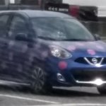 Blue Nissan Micra with pink polka dots