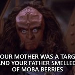 Gowron Insult | YOUR MOTHER WAS A TARG, 
AND YOUR FATHER SMELLED 
OF MOBA BERRIES | image tagged in gowron stares,monty python,monty python and the holy grail,star trek,star trek deep space nine,gowron | made w/ Imgflip meme maker