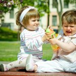 Babies fighting over toy