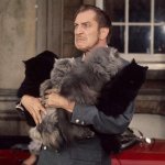 Vincent Price holding cats