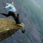 Man Kicking Man off Cliff