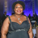 Stacey Abrams in undersized dress