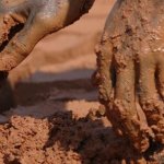 Hands in mud
