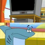 Kenny the Shark watches TV