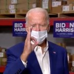 Biden flashing white power sign